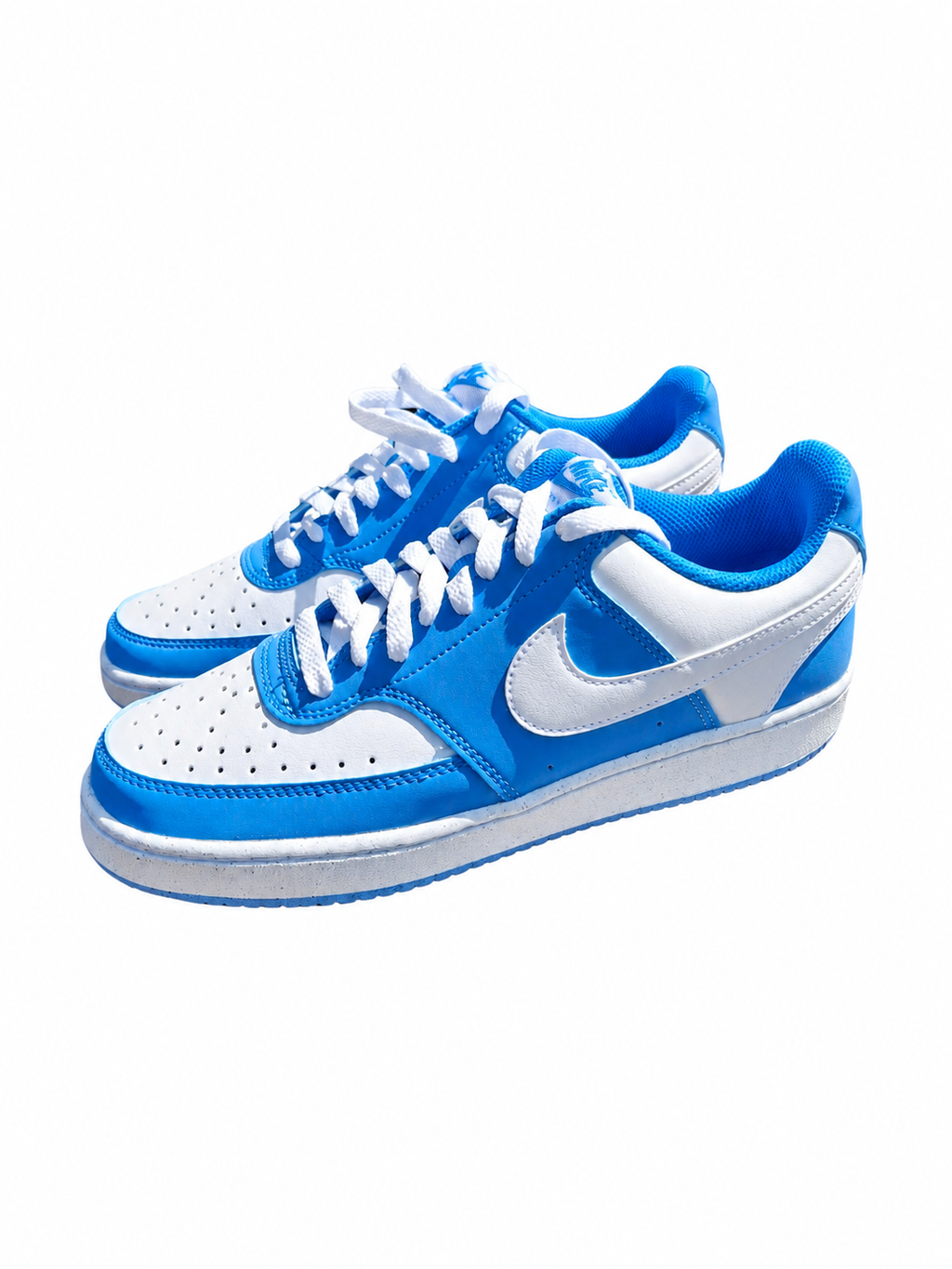 A pair of Nike Air Force 1 Low sneakers in a vibrant blue and white colorway, featuring perforated leather panels, white laces, and the signature Nike Swoosh.